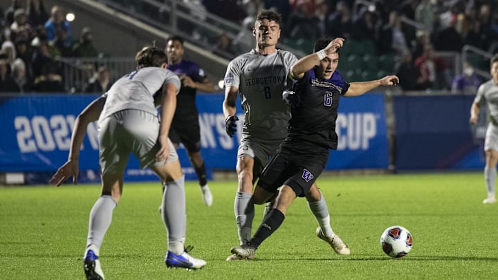 Dec 10, 2021; Cary, NC, USA; Washington midfielder Kalani Kossa-Rienzi (6) dribbles in front of