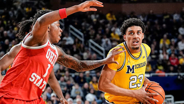 Michigan forward Yaxel Lendeborg (23) goes to the basket against Ohio State forward Amare Bynum (1) during the first half at Crisler Center in Ann Arbor on Friday, Jan. 23, 2026.