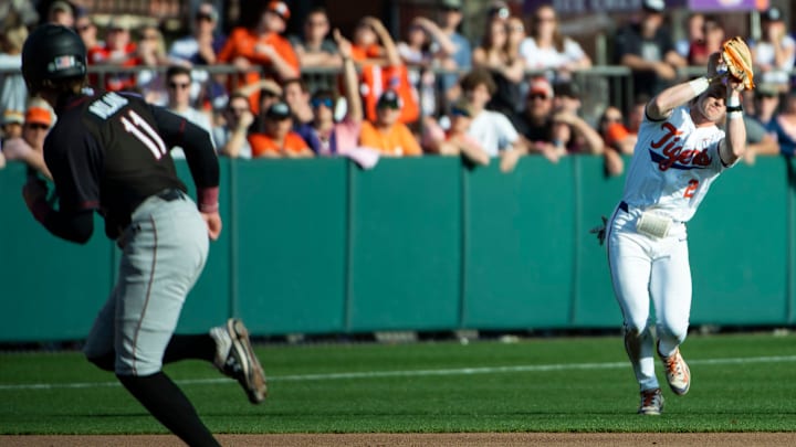 South Carolina baseball 2nd baseman Parker Noland and Clemson Tigers 3rd baseman Nolan Nawrocki in the rivalry game at Clemson earlier this season.