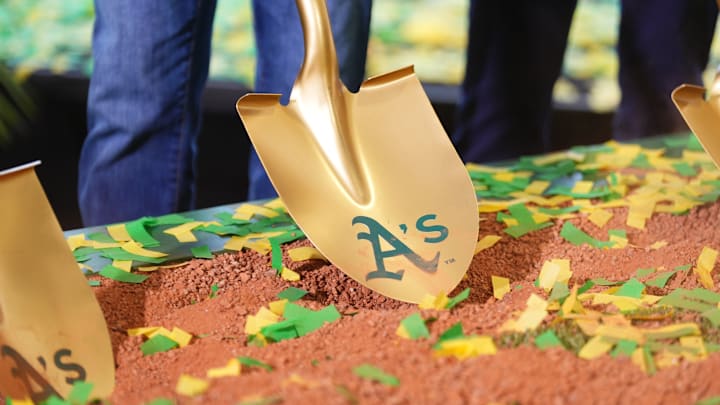 Gold shovel with Athletics on it in the dirt as the team's ceremonial groundbreaking in Las Vegas