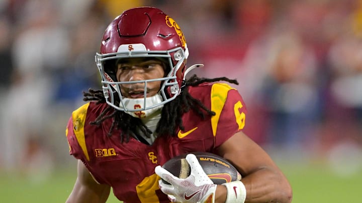 Oct 11, 2025; Los Angeles, California, USA; USC Trojans wide receiver Makai Lemon (6) takes the ball on a kickoff return in the second half against the Michigan Wolverines at United Airlines Field at the Los Angeles Memorial Coliseum. Mandatory Credit: Jayne Kamin-Oncea-Imagn Images