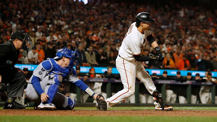 San Francisco, California, USA; San Francisco Giants first baseman Wilmer Flores (41) tries to check his swing against the Los Angeles Dodgers in the ninth inning during game five of the 2021 NLDS at Oracle Park. First base umpire Gabe Morales (47) ruled Flores swung for strike three to end the game. Mandatory Credit: D. Ross Cameron-USA TODAY Sports