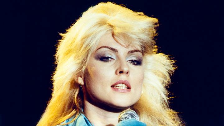 Debbie Harry of Blondie holding microphone Debbie Harry of Blondie holding microphone