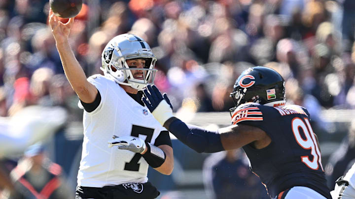 Oct 22, 2023; Chicago, Illinois, USA;  Las Vegas Raiders quarterback Brian Hoyer (7) gets off a pass while being pressured by Chicago Bears defensive lineman Yannick Ngakoue (91) in the second quarter at Soldier Field. Mandatory Credit: Jamie Sabau-Imagn Images
