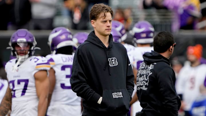 Cincinnati Bengals quarterback Joe Burrow (9) watches his teammates warm up at Paycor Stadium Saturday, December 16, 2023.