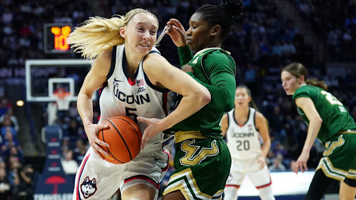 Nov 10, 2024; Storrs, Connecticut, USA; UConn Huskies guard Paige Bueckers (5) drives the ball against South Florida Bulls guard Mama Dembele (4) in the first half at Harry A. Gampel Pavilion. Mandatory Credit: David Butler II-Imagn Images
