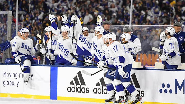 Feb 26, 2022; Nashville, Tennessee, USA; Tampa Bay Lightning players celebrate on the bench after beating the Nashville Predators in a Stadium Series ice hockey game at Nissan Stadium. Mandatory Credit: Christopher Hanewinckel-Imagn Images