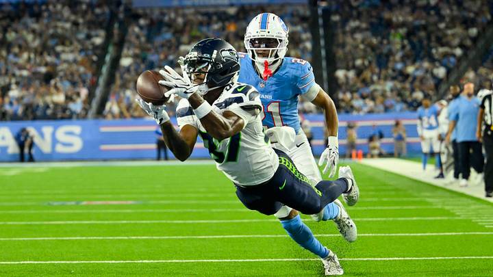 Aug 23, 2026; Nashville, Tennessee, USA; Seattle Seahawks wide receiver Montorie Foster Jr. (87) dives for the ball as Tennessee Titans cornerback Micah Robinson (21) defends during the first half at Nissan Stadium. Mandatory Credit: Steve Roberts-Imagn Images Aug 23, 2026; Nashville, Tennessee, USA; Seattle Seahawks wide receiver Montorie Foster Jr. (87) dives for the ball as Tennessee Titans cornerback Micah Robinson (21) defends during the first half at Nissan Stadium. Mandatory Credit: Steve Roberts-Imagn Images