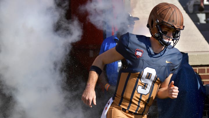 Oct 19, 2024; Champaign, Illinois, USA;  Illinois Fighting Illini quarterback Luke Altmyer (9) takes the field before the first half against the Michigan Wolverines at Memorial Stadium. Mandatory Credit: Ron Johnson-Imagn Images