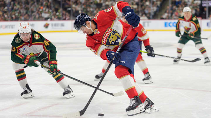 Jan 24, 2026; Saint Paul, Minnesota, USA; Florida Panthers center Evan Rodrigues (17) is challenged by Minnesota Wild defenseman Quinn Hughes (43) in the third period at Grand Casino Arena. Mandatory Credit: Matt Blewett-Imagn Images