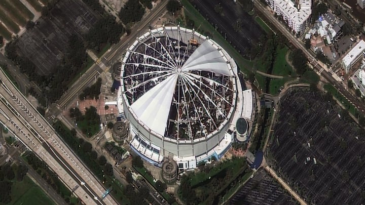 The roof of Tropicana Field, home of the Tampa Bay Rays MLB team, was torn off by Hurricane Milton's powerful winds. Satellite imagery from Maxar shows the destruction on Oct. 10, 2024. Prior to landfall, the stadium was converted into a base camp for emergency responders. The roof of Tropicana Field, home of the Tampa Bay Rays MLB team, was torn off by Hurricane Milton's powerful winds. Satellite imagery from Maxar shows the destruction on Oct. 10, 2024. Prior to landfall, the stadium was converted into a base camp for emergency responders.