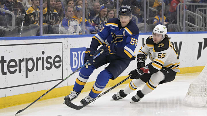 Apr 2, 2023; St. Louis, Missouri, USA; Boston Bruins left wing Tyler Bertuzzi (59) pressures St. Louis Blues defenseman Colton Parayko (55) during the first period at Enterprise Center. Mandatory Credit: Jeff Le-Imagn Images