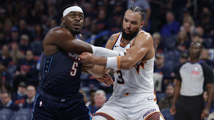 Apr 22, 2026; Oklahoma City, Oklahoma, USA; Oklahoma City Thunder guard Luguentz Dort (5) and Phoenix Suns forward Dillon Brooks (3) in the second half during game two of the first round of the 2026 NBA Playoffs at Paycom Center. Mandatory Credit: Alonzo Adams-Imagn Images