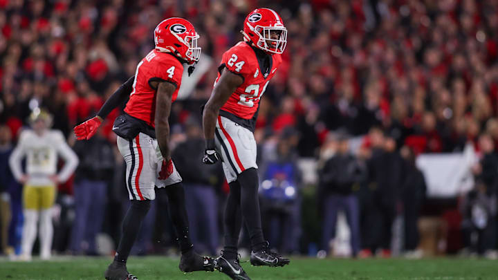 Nov 29, 2024; Athens, Georgia, USA; Georgia Bulldogs defensive back KJ Bolden (4) and defensive back Malaki Starks (24) react after a turnover on downs against the Georgia Tech Yellow Jackets in the first quarter at Sanford Stadium. Mandatory Credit: Brett Davis-Imagn Images