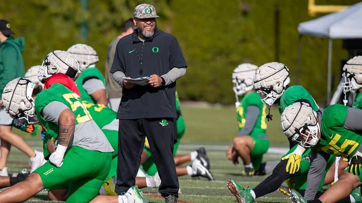 Oregon offensive line coach Tony Tuioti walks the field during practice with the Oregon Ducks Tuesday, April 9, 2024, at the Hatfield-Dowlin Complex in Eugene, Ore.