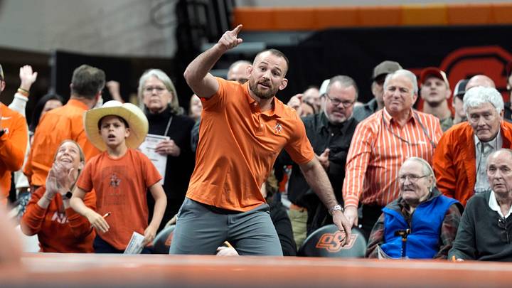 Oklahoma State Cowboys wrestling coach David Taylor gestures during a college wrestling dual vs. the Iowa State Cyclones. Oklahoma State Cowboys wrestling coach David Taylor gestures during a college wrestling dual vs. the Iowa State Cyclones.