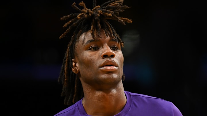 Nov 10, 2024; Los Angeles, California, USA; Toronto Raptors guard Ja'Kobe Walter (14) warms up before the game against the Los Angeles Lakers at Crypto.com Arena. Mandatory Credit: Jonathan Hui-Imagn Images