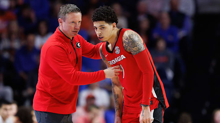 Jan 25, 2025; Gainesville, Florida, USA; Georgia Bulldogs head coach Mike White talks with Georgia Bulldogs guard Dakota Leffew (1) against the Florida Gators during the second half at Exactech Arena at the Stephen C. O'Connell Center. Mandatory Credit: Matt Pendleton-Imagn Images Jan 25, 2025; Gainesville, Florida, USA; Georgia Bulldogs head coach Mike White talks with Georgia Bulldogs guard Dakota Leffew (1) against the Florida Gators during the second half at Exactech Arena at the Stephen C. O'Connell Center. Mandatory Credit: Matt Pendleton-Imagn Images