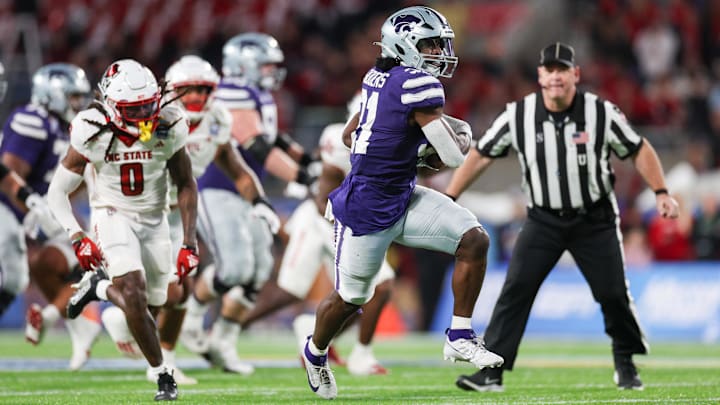 Dec 28, 2023; Orlando, FL, USA;  Kansas State Wildcats running back DJ Giddens (31) runs a pass into the endzone for a touchdown.