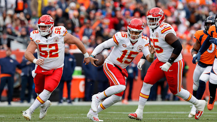 Oct 29, 2023; Denver, Colorado, USA; Kansas City Chiefs quarterback Patrick Mahomes (15) runs the ball as center Creed Humphrey (52) and guard Trey Smith (65) defend in the first quarter against the Denver Broncos at Empower Field at Mile High. Mandatory Credit: Isaiah J. Downing-Imagn Images