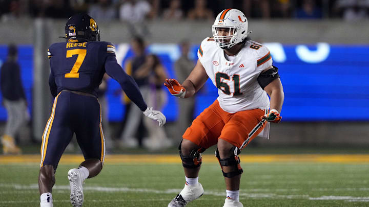 Oct 5, 2024; Berkeley, California, USA; Miami Hurricanes offensive lineman Francis Mauigoa (61) blocks against California Golden Bears linebacker David Reese (7) during the first quarter at California Memorial Stadium. Mandatory Credit: Darren Yamashita-Imagn Images Oct 5, 2024; Berkeley, California, USA; Miami Hurricanes offensive lineman Francis Mauigoa (61) blocks against California Golden Bears linebacker David Reese (7) during the first quarter at California Memorial Stadium. Mandatory Credit: Darren Yamashita-Imagn Images