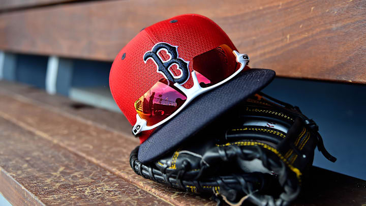 Mar 5, 2019; West Palm Beach, FL, USA; A detailed view of a Boston Red Sox cap, sunglasses and glove in the dugout  during a spring training game between the Washington Nationals and the Boston Red Sox at FITTEAM Ballpark of the Palm Beaches. Mandatory Credit: Jasen Vinlove-Imagn Images