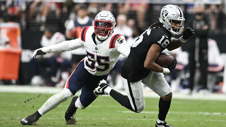 Oct 15, 2023; Paradise, Nevada, USA; New England Patriots linebacker Josh Uche (55) tries to tackle Las Vegas Raiders wide receiver Jakobi Meyers (16) in the second quarter at Allegiant Stadium. Mandatory Credit: Candice Ward-Imagn Images