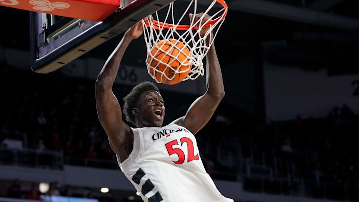 Cincinnati Bearcats center Moustapha Thiam (52) dunks in the first half of the NCAA men’s basketball game between the Cincinnati Bearcats and the NJIT Highlanders at Fifth Third Arena in Cincinnati on Monday, Nov. 24, 2025. Cincinnati Bearcats center Moustapha Thiam (52) dunks in the first half of the NCAA men’s basketball game between the Cincinnati Bearcats and the NJIT Highlanders at Fifth Third Arena in Cincinnati on Monday, Nov. 24, 2025.