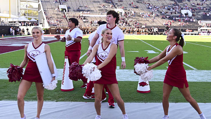 Oct 26, 2024; Starkville, Mississippi, USA; Arkansas Razorbacks cheerleaders cheer during the fourth quarter against the Mississippi State Bulldogs at Davis Wade Stadium at Scott Field. Mandatory Credit: Matt Bush-Imagn Images