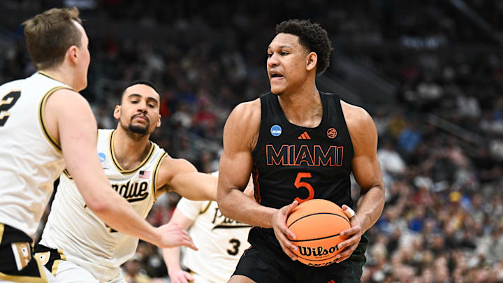 Mar 22, 2026; St. Louis, MO, USA; Miami Hurricanes forward Malik Reneau (5) looks to pass as Purdue Boilermakers guard Fletcher Loyer (2) defends during the second half during a second round game of the men's 2026 NCAA Tournament at Enterprise Center. Mandatory Credit: Jeff Le-Imagn Images Mar 22, 2026; St. Louis, MO, USA; Miami Hurricanes forward Malik Reneau (5) looks to pass as Purdue Boilermakers guard Fletcher Loyer (2) defends during the second half during a second round game of the men's 2026 NCAA Tournament at Enterprise Center. Mandatory Credit: Jeff Le-Imagn Images