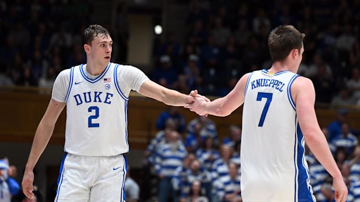 Dec 17, 2024; Durham, North Carolina, USA; Duke Blue Devils forward Cooper Flagg (2) and forward Kon Knueppel (7) react during the second half against the George Mason Patriots at Cameron Indoor Stadium. Mandatory Credit: Rob Kinnan-Imagn Images