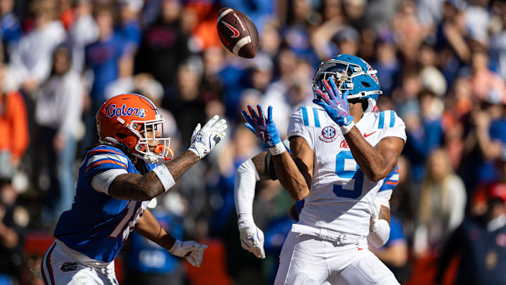 Mississippi Rebels Tre Harris makes a catch for a touchdown over Florida Gators defensive back Bryce Thornton.