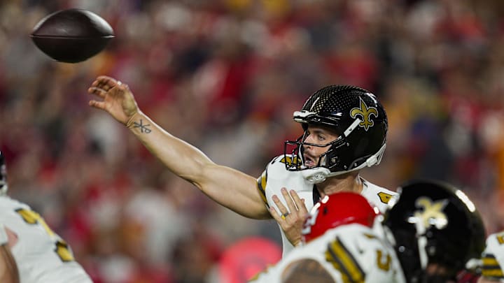 Oct 7, 2024; Kansas City, Missouri, USA; New Orleans Saints quarterback Derek Carr (4) throws a pass during the first half against the Kansas City Chiefs at GEHA Field at Arrowhead Stadium. Mandatory Credit: Jay Biggerstaff-Imagn Images