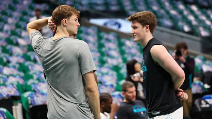 Dallas Mavericks forward Cooper Flagg (left) speaks with Charlotte Hornets guard Kon Knueppel (right) before the game Dallas Mavericks forward Cooper Flagg (left) speaks with Charlotte Hornets guard Kon Knueppel (right) before the game