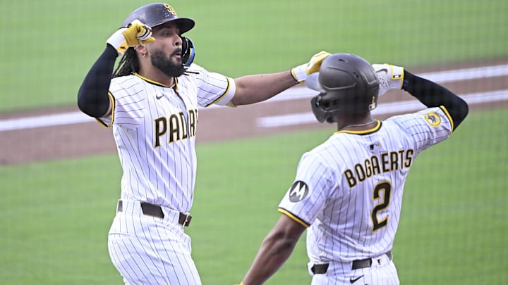 San Diego Padres right fielder Fernando Tatis Jr., left is congratulated by Luis Arraez. San Diego Padres right fielder Fernando Tatis Jr., left is congratulated by Luis Arraez.