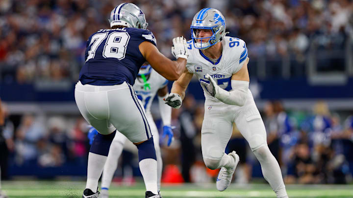 Oct 13, 2024; Arlington, Texas, USA; Detroit Lions defensive end Aidan Hutchinson (97) rushes the passer with Dallas Cowboys offensive tackle Terence Steele (78) blocking during the third quarter at AT&T Stadium.