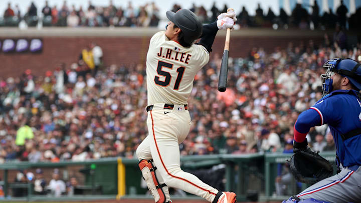 San Francisco, California, USA; San Francisco Giants outfielder Jung Hoo Lee (51) bats against Texas Rangers catcher Jonah Heim (28) during the third inning at Oracle Park. San Francisco, California, USA; San Francisco Giants outfielder Jung Hoo Lee (51) bats against Texas Rangers catcher Jonah Heim (28) during the third inning at Oracle Park.