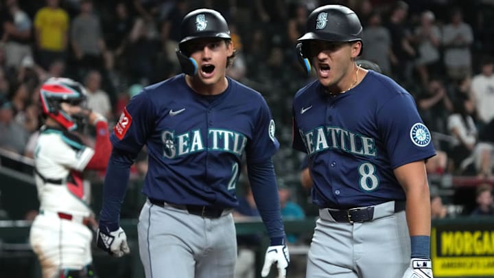 Seattle Mariners outfielder Dominic Canzone (8) celebrates with second baseman Cole Young after a home run against the Arizona Diamondbacks on June 9 at Chase Field.