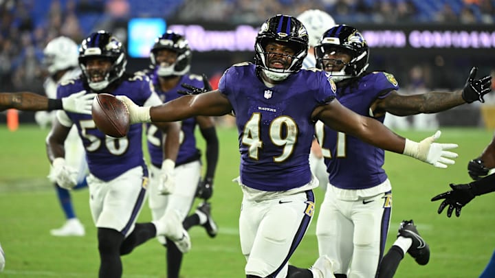 Aug 7, 2025; Baltimore, Maryland, USA; Baltimore Ravens linebacker Jay Higgins IV (49) celebrates after an interception against the Indianapolis Colts during the fourth quarter at M&T Bank Stadium. Mandatory Credit: Rafael Suanes-Imagn Images