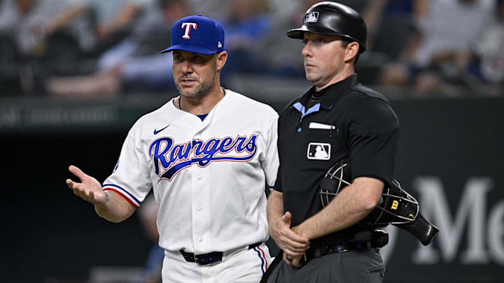 Texas Rangers manager Skip Schumaker (left).