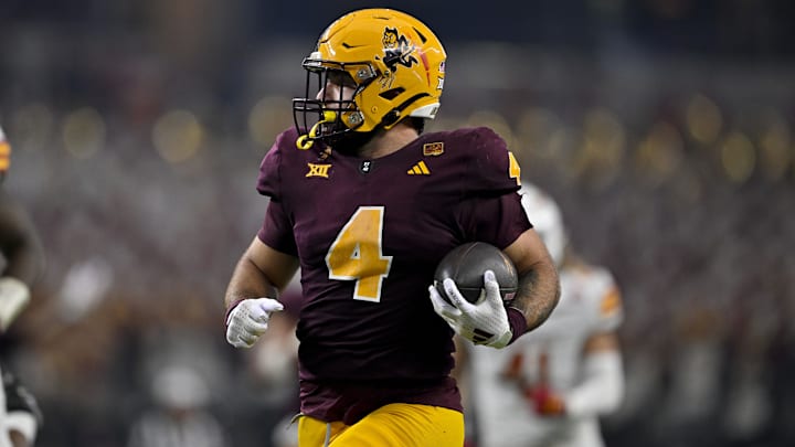 Dec 7, 2024; Arlington, TX, USA; Arizona State Sun Devils running back Cam Skattebo (4) in action during the game between the Iowa State Cyclones and the Arizona State Sun Devils at AT&T Stadium. 