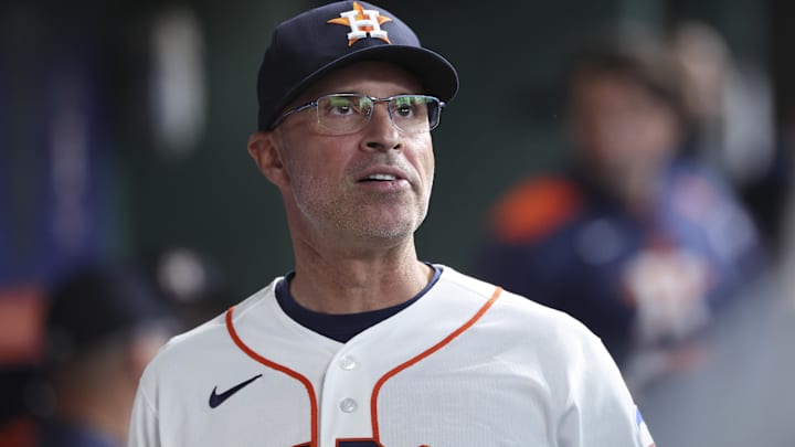 Apr 14, 2026; Houston, Texas, USA; Houston Astros manager Joe Espada looks on from the dugout before the game against the Colorado Rockies at Daikin Park.