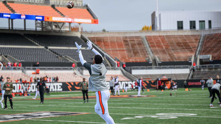 Nov 1, 2025; Corvallis, Oregon, USA; Oregon State Beavers wide receiver David Wells Jr. (1) (obscured) warms up on the field before the game against the Washington State Cougars at Reser Stadium. Mandatory Credit: Craig Strobeck-Imagn Images