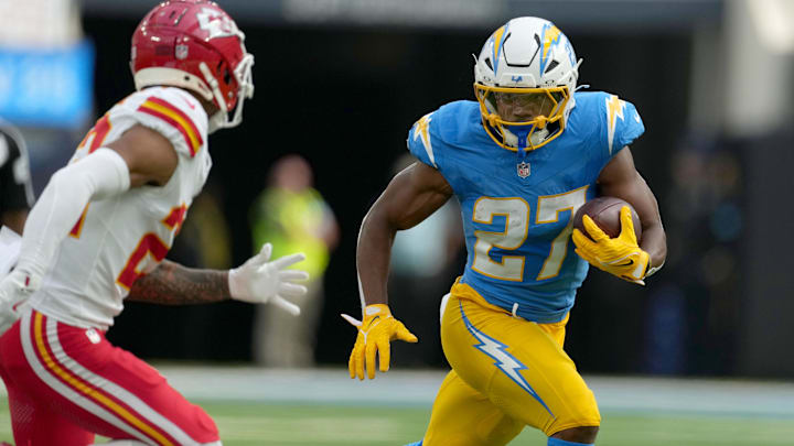 Sep 29, 2024; Inglewood, California, USA; Los Angeles Chargers running back J.K. Dobbins (27) carries the ball in the first quarter against the Kansas City Chiefs at SoFi Stadium. Mandatory Credit: Kirby Lee-Imagn Images