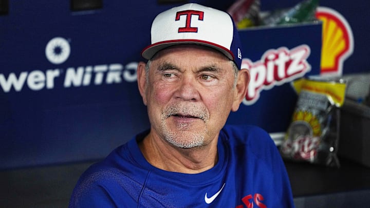 Aug 16, 2025; Toronto, Ontario, CAN; Texas Rangers manager Bruce Bochy (15) talks with the media in the dugout during batting practice before a game against the Toronto Blue Jays