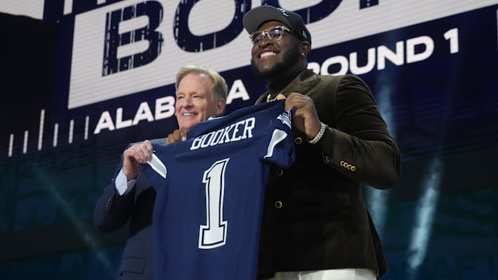 NFL commissioner Roger Goodell with Alabama Crimson Tide OL Tyler Booker after he is selected by the Dallas Cowboys. NFL commissioner Roger Goodell with Alabama Crimson Tide OL Tyler Booker after he is selected by the Dallas Cowboys.