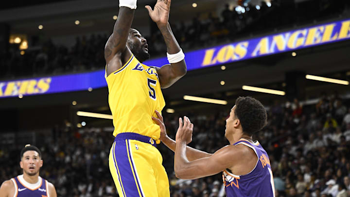 Oct 3, 2025; Palm Desert, California, USA; Los Angeles Lakers center Deandre Ayton (5) shoots over Phoenix Suns center Oso Ighodaro (11) during the first half at Acrisure Arena. Mandatory Credit: Denis Poroy-Imagn Images