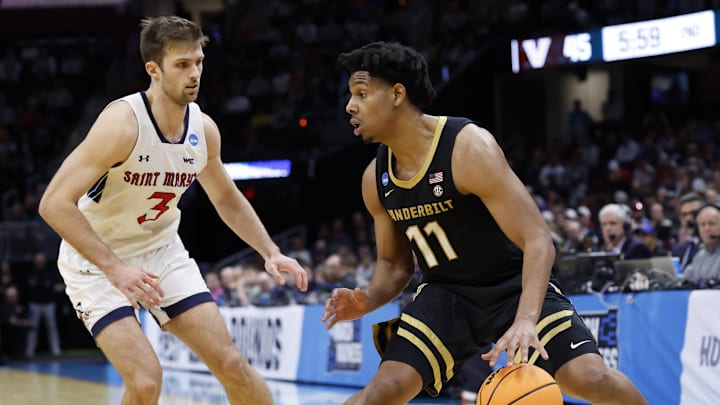 Mar 21, 2025; Cleveland, OH, USA; Vanderbilt Commodores guard AJ Hoggard (11) dribbles defended by St. Mary's Gaels guard Augustas Marciulionis (3) in the second half at Rocket Arena. Mandatory Credit: Rick Osentoski-Imagn Images Mar 21, 2025; Cleveland, OH, USA; Vanderbilt Commodores guard AJ Hoggard (11) dribbles defended by St. Mary's Gaels guard Augustas Marciulionis (3) in the second half at Rocket Arena. Mandatory Credit: Rick Osentoski-Imagn Images