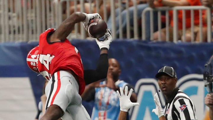 Georgia defensive back Malaki Starks (24) picks off a pass from Clemson quarterback Cade Klubnik (2) during the second half of the NCAA Aflac Kickoff Game against Clemson in Atlanta, on Saturday, Aug. 31, 2024.