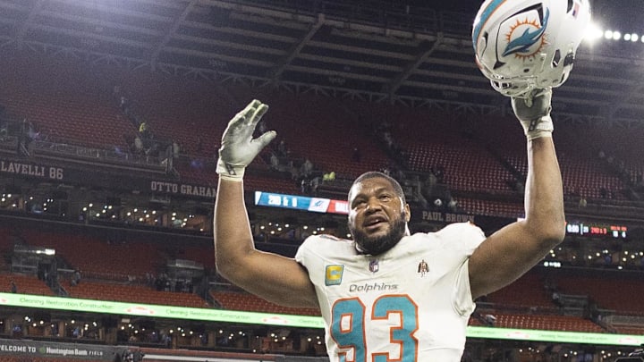 Dec 29, 2024; Cleveland, Ohio, USA; Miami Dolphins defensive tackle Calais Campbell (93) celebrates as he leaves the field following the win against the Cleveland Browns at Huntington Bank Field. Mandatory Credit: Scott Galvin-Imagn Images